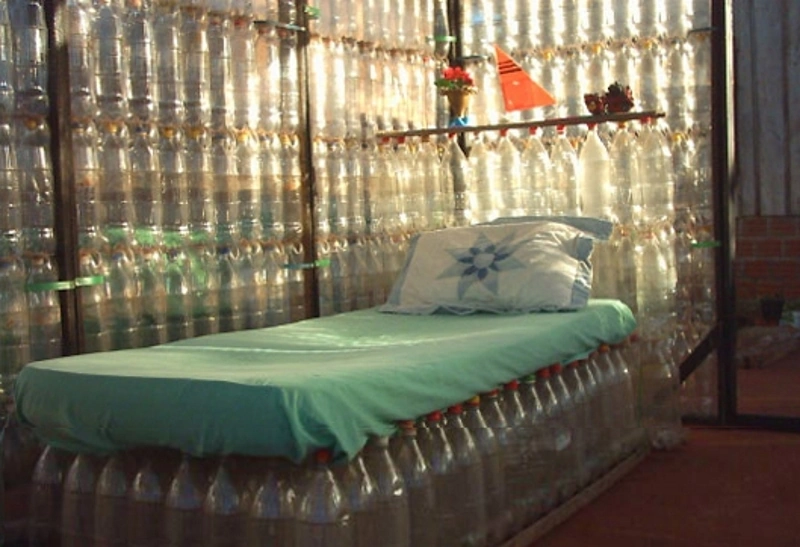 a bed made entirely of bottles